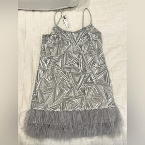Silver and grey party dress. Never been worn. Tags still on.